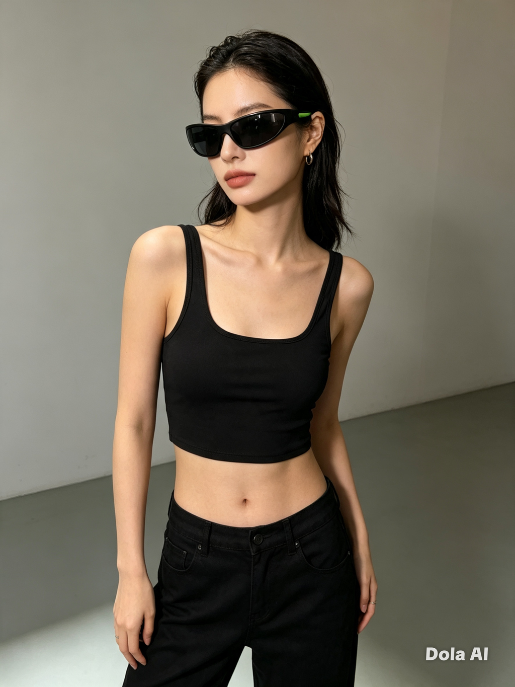Foster Grant Sports Wrap Sunglasses - female model in black crop top and jeans studio