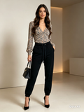 Collusion Black Joggers - styled with floral blouse indoor